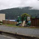 A portion of fence at Juneau Montessori School is missing following a hit-and-run crash early Thursday morning. (Clarise Larson / Juneau Empire)