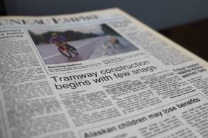 This is a photo of the front page of the Juneau Empire published on Tuesday, Aug. 15, 1995, from an archived book. (Clarise Larson / Juneau Empire)