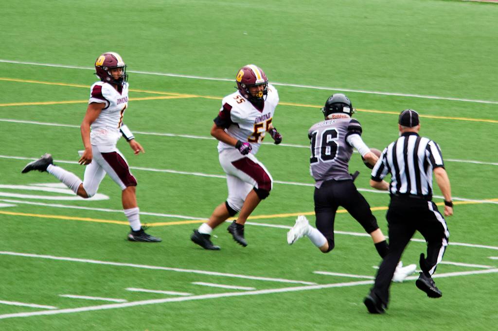 Juneau running back/linebacker Caleb Ziegenfuss returns an interception deep into Dimond territory in the second half of Saturdays game at at Adair-Kennedy Field. (Mark Sabbatini / Juneau Empire)