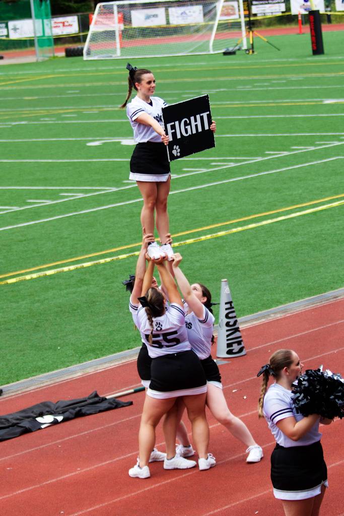 Juneau Huskies cheerleaders urge the crowd on after Juneau rallies closes a 32-14 deficit to 32-27 early in the fourth quarter at Adair-Kennedy Field. (Mark Sabbatini / Juneau Empire)