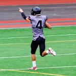 Jayden Johnson scores on a 91-yard run early in the fourth quarter to give the Juneau Huskies their first lead by a score of 33-32 against Dimond High School on Saturday at Adair-Kennedy Field.(Mark Sabbatini / Juneau Empire)