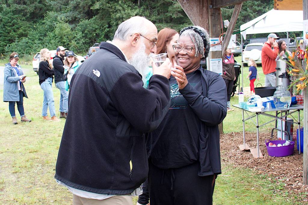 Bruce Weeks tries a drink of water flavored with produce during the 29th Annual Juneau Community Garden Harvest Fair on Saturday. Charmaine (Mark Sabbatini / Juneau Empire)