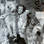 Mary Joyce, a former Taku Lodge owner, arrives in Fairbanks with her lead dog Tip posing on her knee. (Courtesy of Ken and Mic Ward)