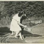 Mary Joyce at Taku Lodge with one of her cows, Myra. Joyce hated canned milk, so Erie Smith cruised to Alaska one summer with Myra on board. Myra and her children, Mukluk (aka Muckluck) and Moccasin, provided milk and butter to summer lodge guests. Myra wintered and was bred in Juneau. (Courtesy of Ken and Mic Ward)