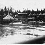 A early photo (circa 1923-1924) of Taku Lodge with Dr. Harry Carlos DeVighnes guest tents. (Courtesy of Ken and Mic Ward)