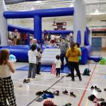 Kids play in the bouncy house during Floyd Dryden Middle Schools 50th anniversary celebration Wednesday. (Meredith Jordan / Juneau Empire)