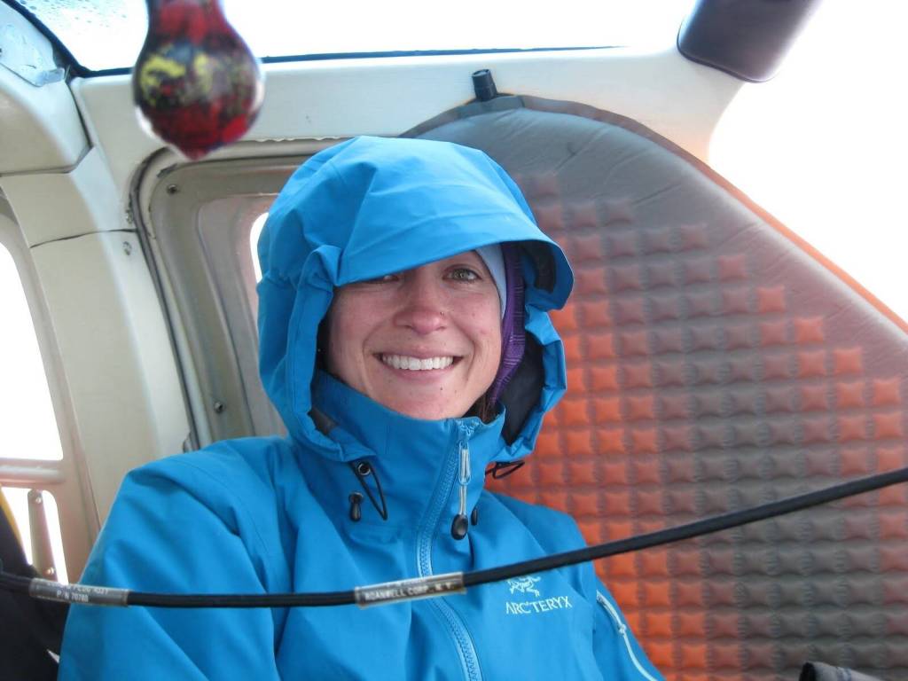 Volcano researcher Taryn Lopez smiles during her 48-hour wait inside a stranded Jet Ranger helicopter on top of Mount Mageik. (Photo courtesy of Taryn Lopez)