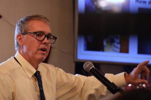 Rorie Watt, manager for the City and Borough of Juneau, speaks to the Greater Juneau Chamber of Commerce about the new City Hall project on Thursday. (Clarise Larson / Juneau Empire)