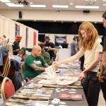 Clarise Larson / Juneau Empire
People check out tattoo designs Thursday afternoon at Elizabeth Peratrovich Hall during the Ink Masters Tattoo Show.