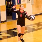 Gwen Nizich prepares to serve for Juneau-Douglas High School: Yadaa.at Kalé during their match against Thunder Mountain High School on Friday night. (Mark Sabbatini / Juneau Empire)
