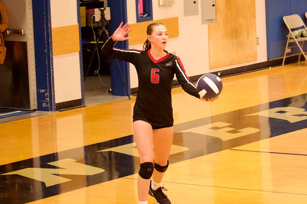 Gwen Nizich prepares to serve for Juneau-Douglas High School: Yadaa.at Kalé during their match against Thunder Mountain High School on Friday night. (Mark Sabbatini / Juneau Empire)