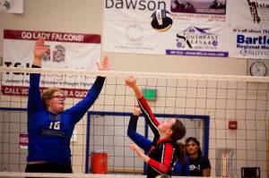 Chloe Casperson (right) of Juneau-Douglas High School: Yadaa.at Kalé tries to get a shot by Adella Dinle of Thunder Mountain High School during a game on Friday night at TMHS. TMHS swept all three games during the evening, with the teams set for a rematch Saturday at JDHS. (Mark Sabbatini / Juneau Empire)