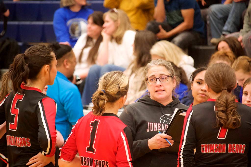 Jody Levernier, volleyball coach at Juneau-Douglas High School: Yadaa.at Kalé, huddles with her team during a timeout during their matchup against Thunder Mountain High School on Friday night. (Mark Sabbatini / Juneau Empire)