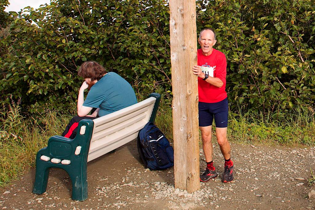 Rick Becker rests against the Father Brown Cross after finishing second in the Goldbelt Tram-Mount Roberts Run on Saturday. He said it was the first trail race he has participated in. (Mark Sabbatini / Juneau Empire)