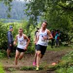 Juneau-Douglas High School: Yadaa.at Kalé senior racer Oliver Zigmund leads a pack of runners as they charge up a hill during the Sayeik Invitational on Douglas Saturday morning. Zigmund finished the race 10th with a time of 18 minutes and 18 seconds. (Clarise Larson / Juneau Empire)