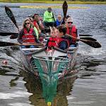 Brandon and Jackson Kessler, at front of boat, haul the first-place duck worth $5,000 in a net after it was snagged from among 5,768 others dropped over Twin Lakes on Saturday during the Glacier Valley Rotary Duck Derby. Will Fischer was the purchaser of the lucky duck. (Photo by Kelly Moore)