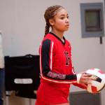 Nikki King prepares to serve for Juneau-Douglas High School: Yadaa.at Kalé during the teams homecourt matchup against Thunder Mountain High School on Saturday night. (Mark Sabbatini / Juneau Empire)
