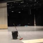 A broom and garbage bin sits in the middle of the newly renovated Centennial Hall. (Clarise Larson / Juneau Empire)