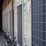 Six new heat pumps sit on a outside balcony on the side of the Centennial Hall building. The new pumps mean more energy efficiency and allows all three ballrooms section to be individually temperature controlled. (Clarise Larson / Juneau Empire)