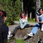 From left to right, students Kelby Randall, KC Abad and Sage Chavez smile as they sit outside during a lunch break Monday afternoon at the University of Alaska Southeast campus in Juneau on the first day of the 2023 fall semester. (Clarise Larson / Juneau Empire)