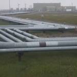 A network of pipelines, seen on Aug. 23, 2018, snakes through a portion of the Greater Prudhoe Bay Unit on Alaskas North Slope. The oil and gas industry has more impact on Alaskas economy than any other industry, a new study finds. (Photo by Yereth Rosen/Alaska Beacon)