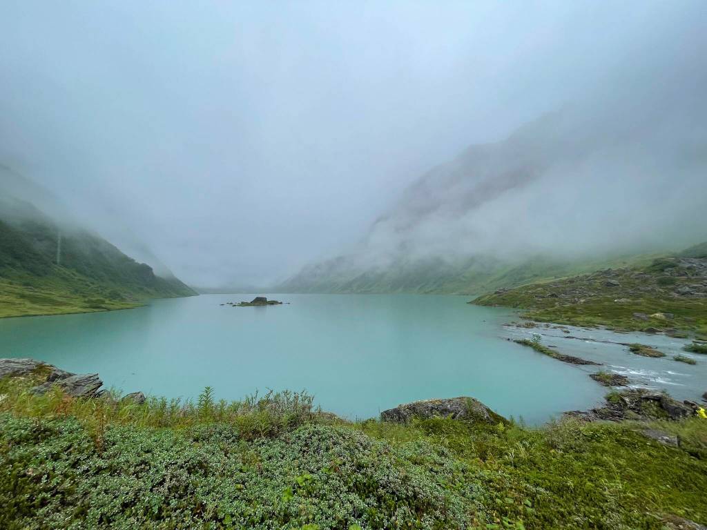 A steady rain falls on Allison Lake, a basin perched above Valdez in the Chugach Mountains. (Photo by Ned Rozell)