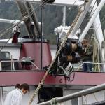 Norval Nelson, owner and operator of Star of the Sea, and his wife, Barbara Cadiente, clean and prep the boat in Aurora Harbor on Wednesday, the same day the Alaska Department of Fish and Game announced commercial crab fisheries would remain closed again this year. (Meredith Jordan/Juneau Empire)