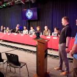 Sterling Salisbury (right), president of the Juneau Police Department Employees Association, and Travis Wolf, president of the International Association of Firefighters Local 4303 in Juneau, explain the format and rules of a Thursday night debate at the KTOO studios about public safety by 13 candidates seeking four open seats on the City and Borough of Juneau Assembly. (Mark Sabbatini / Juneau Empire)