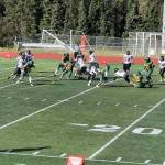 Juneaus Jayden Johnson (4) is stopped for a short gain during the Huskies game against Service High School on Saturday in Anchorage. Juneau head coach Rich Sjoroos said Service tried to contain Johnson, the Huskies biggest playmaker this year, by having a defensive player shadow him during the game. (Courtesy of Juneau Huskies Football)