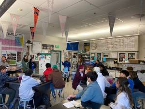 Thunder Mountain High School receives a five-year banner marking its successful participation in NOAAs Ocean Guardian School Program on Wednesday, the first school in the state to reach the milestone. Teacher Kristen Wells, far left, and students Lucy Bennett and Steffanie Reynoso were presented with the banner by Kim Raum-Suryan, who coordinates the Ocean Guardian School Program in Alaska, Anne Marie Eich, assistant regional administrator of NOAAs Protected Resources Division, and Michelle Trifari, an Alaska Sea Grant Fellow. (Meredith Jordan/ Juneau Empire)