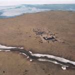 An aerial shows the footprint of the test well drilled in the mid-1980s on land owned by the Kaktovik Native village corporation within the 1002 area of the Arctic National Wildlife Refuge. The well is 14 miles east of Kaktovik and the melting the Beaufort Sea is at the top of the picture. One of the bidders in an oil and gas lease sale for the Arctic National Wildlife Refuge last year has canceled the lease it bought, the U.S. Interior Department said. (Michael Penn / Juneau Empire File)