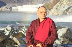 Tibetan Buddhist Lama Khentrul Lodrö Thayé Rinpoche on a trip to the Mendenhall Glacier in 2018, his last visit to Juneau. He is returning for a talk on Sept. 14 at Juneau Arts and Humanities Council. (Photo courtesy Karin Dvorak)