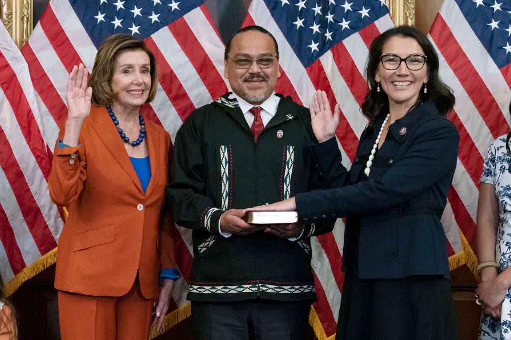 Speaker of the House Nancy Pelosi of Calif., left, administers the House oath of office to Rep. Mary Peltola, D-Alaska, standing next to her husband Eugene Buzzy Peltola Jr., center, during a ceremonial swearing-in on Capitol Hill in Washington, Tuesday, Sept. 13, 2022. Peltolas husband Eugene died in an airplane crash in Western Alaska on Sept. 13, 2023. (AP Photo/Jose Luis Magana, File)