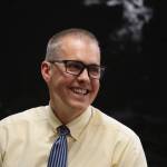 Retiring City and Borough of Juneau Manager Rorie Watt smiles as he is honored during an Assembly meeting Monday night. Watt will be officially departing at the end of September after announcing his plan to retire in April. Public Works and Engineering Director Katie Koester was selected to take over the role. (Clarise Larson / Juneau Empire)