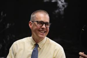 Retiring City and Borough of Juneau Manager Rorie Watt smiles as he is honored during an Assembly meeting Monday night. Watt will be officially departing at the end of September after announcing his plan to retire in April. Public Works and Engineering Director Katie Koester was selected to take over the role. (Clarise Larson / Juneau Empire)