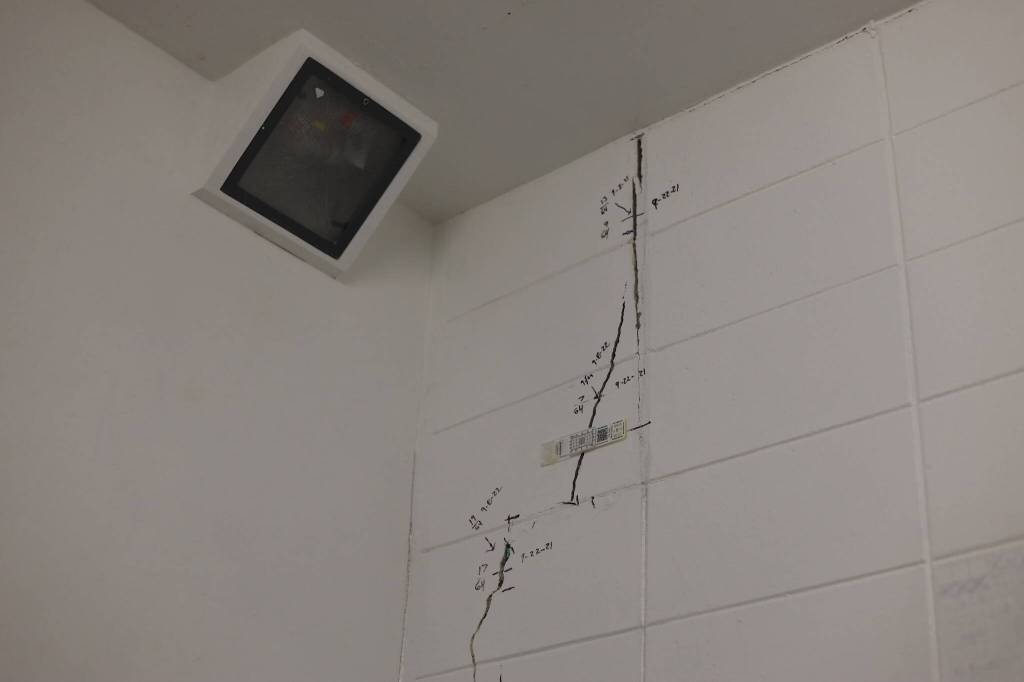Measuring devices and markings surround cracks in the walls of a cell at Lemon Creek Correctional Center Monday. The prison is currently undergoing structural repairs and renovations following extreme wet weather last fall that caused instability at certain locations and prompted emergency repairs. (Clarise Larson / Juneau Empire)
