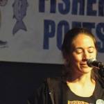 Author Tele Aadsen performing at her first FisherPoets Gathering in 2012. Her book, What Water Holds, is a collection of essays she wrote for the annual festival over the next 12 years. (Photo courtesy Pat Dixon)