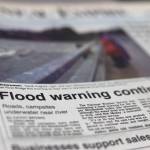 Sandi Hughes, right, and Sam Messerschmidt watch the raging Mendenhall River from the Mendenhall River Bridge on their way to Mendenhall River Elementary School on Monday, Sept. 11, 1995. (Brian Wallace / Juneau Empire Archives)