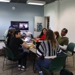 Aakw Rock festival organizers meet on Tuesday at the Juneau Arts and Humanities Council office. Pictured are NeilgaKoogéi Revels, in red, then Reggie Schapp to her right, followed by Rob Stephenson, Taylor Vidic, Zac Pease, Qacung Blanchett, Kathleen Harper and Phil Huebschen. (Meredith Jordan/Juneau Empire)