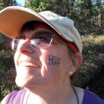 LJ Evans shows her temporary tattoo for Team in Training, a group that raised money for cancer research in exchange for training to run the race, during the 2009 Equinox Marathon. (Photo by Ned Rozell)