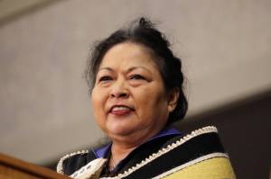 Chilkat weaver Anna Brown Ehlers smiles while on stage at the 2023 University of Alaska Southeast commencement ceremony in May. Ehlers was bestowed a honorary Doctorate of Fine Arts during the event. (Clarise Larson / Juneau Empire File)