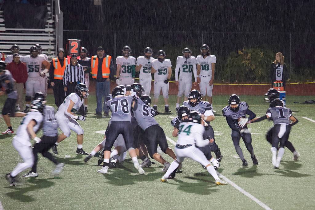 Anthony Garcia (22) carries the ball for Juneau during the Huskies rematch of last years state title game against Colony High School on Friday night at Adair-Kennedy Field. (Mark Sabbatini / Juneau Empire)