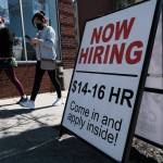 A company advertises a help wanted sign on April 9, 2021 in Pawtucket, Rhode Island. (Photo by Spencer Platt/Getty Images)