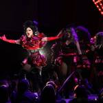 Longtime Juneau drag pillar Gigi Monroe leads a dance alongside other performers during the eighth annual GLITZ drag show at the Centennial Hall ballroom Saturday night. (Clarise Larson / Juneau Empire)