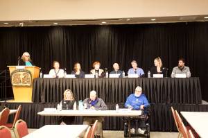 Eleven of the 14 candidates seeking four seats on the Juneau Assembly in the Oct. 3 municipal election answer questions during a forum Friday night at Elizabeth Peratrovich Hall. (Mark Sabbatini / Juneau Empire)