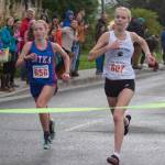 Juneau-Douglas High School: Yadaa.at Kalé junior Ida Meyer, right, wins the Sitka Invitational by a fraction of a second in front of Sitka junior Clare Mullin on Saturday. (James Poulson / Sitka Sentinel)