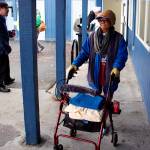 Maria Norman, 80, guides her wheelchair/walker toward the front patio space of the senior living building at the St. Vincent de Paul of Juneau complex on Teal Street on Saturday. About 30 Juneau residents visited the complex during the morning as part of a Friends of the Poor Run/Walk to raise money for the facility and its programs. (Mark Sabbatini / Juneau Empire)