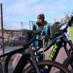 John McConnochie, co-owner of Cycle Alaska, and Ter Schnetter, retail manager, stand near a row of e-bikes for sale at Juneaus EV & E-bike Roundup downtown Saturday afternoon. (Clarise Larson / Juneau Empire)