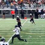 Juneaus Anthony Garcia (22) carries the ball deep into West Anchorage High School territory to set up the Huskies first touchdown early in the third quarter during Saturdays game in Anchorage. (Screenshot from Juneau Huskies football livestream video)