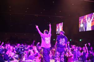 Snotty Nose Rez Kids rappers Yung Trybez and Young D sing to the crowd during a performance as part of the final night of the Áakw Rock music festival at Centennial Hall Saturday evening. (Clarise Larson / Juneau Empire)
